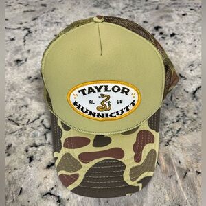 Taylor Hunnicutt Camouflage Trucker Hat